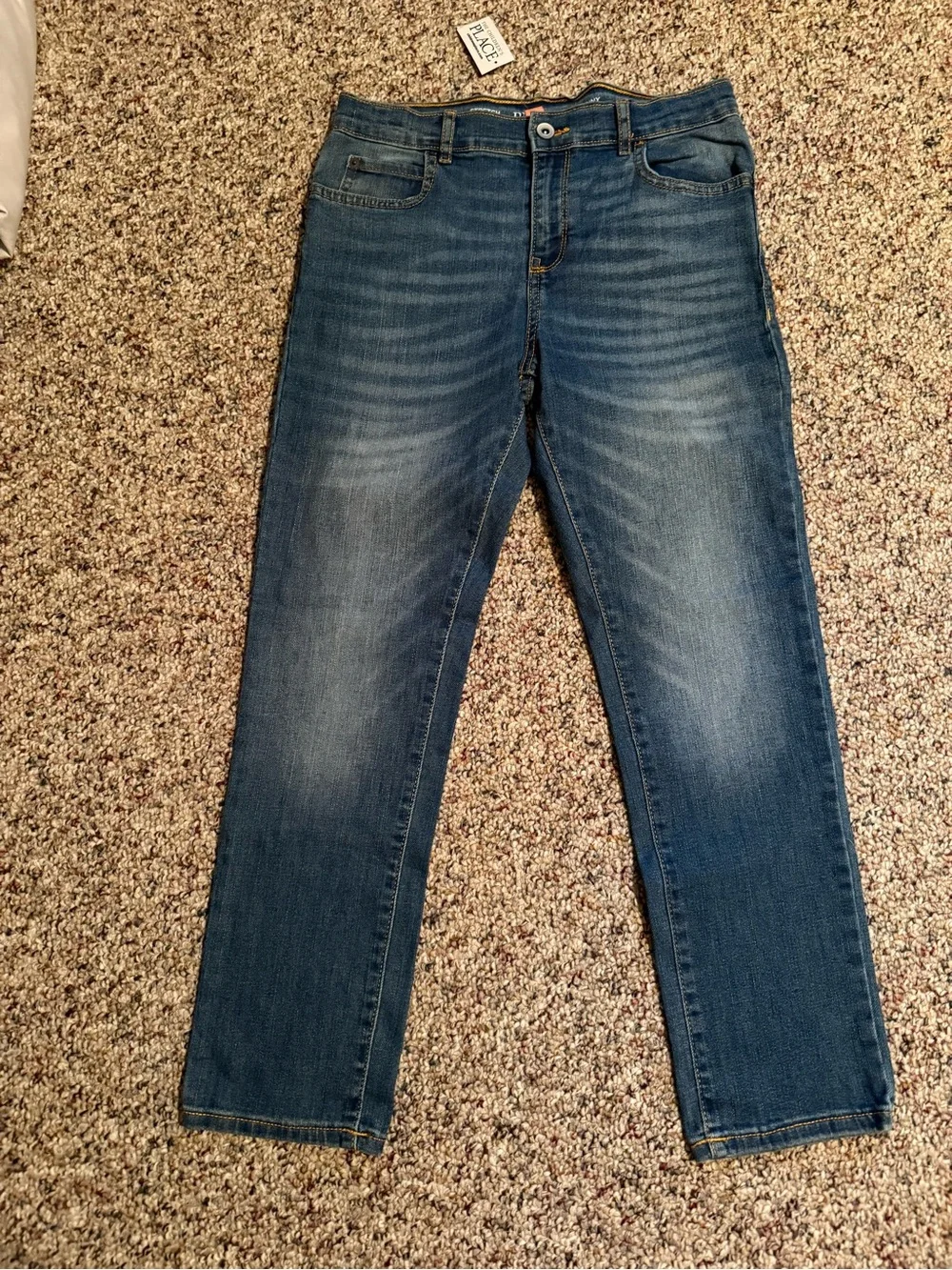 The Children's Place Boys' Stretch skinny jeans in a blue 10 Husky